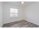 This is a bedroom with light gray flooring and a window at 414 Tranquille Oaks Dr, Ocoee, FL 34761