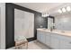 Stylish bathroom featuring double sink vanity, modern lighting, and contemporary decor at 431 Meadowland Pt, Oviedo, FL 32765