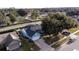 Aerial view of a house with an attached garage in a peaceful residential area, showcasing landscaping and neighborhood at 4523 Saddle Creek Pl, Orlando, FL 32829