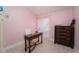 Bright bedroom with a desk, dresser, and a serene atmosphere at 4523 Saddle Creek Pl, Orlando, FL 32829