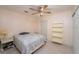 A bedroom with a neutral color scheme, a ceiling fan, and a convenient sliding door closet at 4523 Saddle Creek Pl, Orlando, FL 32829