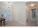 Bright foyer with tiled flooring, white walls, and a front door with an oval window pane at 4523 Saddle Creek Pl, Orlando, FL 32829