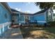 Inviting front porch with chairs and a garden, creating a welcoming outdoor space at 4523 Saddle Creek Pl, Orlando, FL 32829