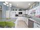 A well-lit kitchen featuring granite countertops, modern appliances, and lots of cabinets at 4523 Saddle Creek Pl, Orlando, FL 32829