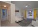 Bright living room adjacent to hallway with a neutral color scheme and lots of natural light at 4523 Saddle Creek Pl, Orlando, FL 32829