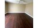 Bedroom features stunning dark wood floors and a ceiling fan at 516 Orange Dr # 17, Altamonte Springs, FL 32701