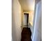 Hallway with wood flooring leading to the bathroom and other rooms at 516 Orange Dr # 17, Altamonte Springs, FL 32701