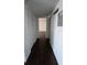 Hallway featuring wood flooring with a closet and view into the adjacent room at 516 Orange Dr # 17, Altamonte Springs, FL 32701