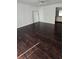 Living room featuring modern dark-wood flooring, white walls, and a ceiling fan at 516 Orange Dr # 17, Altamonte Springs, FL 32701