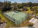 Aerial view of an outdoor basketball court surrounded by lush greenery, offering a perfect recreational space at 533 Little Wekiva Rd, Altamonte Springs, FL 32714