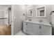 Bathroom with double vanity, modern sinks and faucet fixtures at 533 Little Wekiva Rd, Altamonte Springs, FL 32714