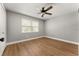 Bedroom featuring hardwood floors, a ceiling fan, and a window for natural light at 533 Little Wekiva Rd, Altamonte Springs, FL 32714