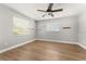 Bright bedroom with wood floors, ceiling fan and ample natural light at 533 Little Wekiva Rd, Altamonte Springs, FL 32714