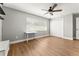 Bedroom with modern ceiling fan, wood floor and large window at 533 Little Wekiva Rd, Altamonte Springs, FL 32714