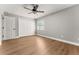 Bedroom featuring hardwood floors, a ceiling fan, closet and a window for natural light at 533 Little Wekiva Rd, Altamonte Springs, FL 32714