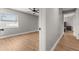 Bedroom featuring hardwood floors, a ceiling fan, and natural light from the window at 533 Little Wekiva Rd, Altamonte Springs, FL 32714