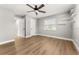 Bedroom with modern ceiling fan, wood floor and large window at 533 Little Wekiva Rd, Altamonte Springs, FL 32714