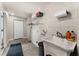 Laundry room with utility sink, shelving, and washer/dryer hookups at 533 Little Wekiva Rd, Altamonte Springs, FL 32714