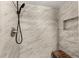 Shower with marble-look tile, a built-in niche, and a wooden bench at 533 Little Wekiva Rd, Altamonte Springs, FL 32714