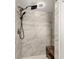 Shower with marble-look tile and bench at 533 Little Wekiva Rd, Altamonte Springs, FL 32714