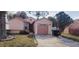 Charming single-story home featuring a well-maintained lawn and attached one car garage at 5436 Bayberry Homes Rd, Orlando, FL 32811