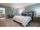 Comfortable main bedroom with soft carpet and an ensuite bathroom at 560 Newton Rd, Port Orange, FL 32127