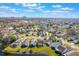 An aerial view capturing the community's picturesque landscaping, lakes and surrounding amenities at 5795 Parkview Lake Dr, Orlando, FL 32821