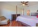 Spacious bedroom featuring wood floors, a ceiling fan, and dark wood furniture at 5795 Parkview Lake Dr, Orlando, FL 32821