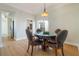 Elegant dining room featuring wood floors and large windows to backyard at 5795 Parkview Lake Dr, Orlando, FL 32821