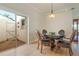 Elegant dining room featuring wood floors and large sliding doors to patio at 5795 Parkview Lake Dr, Orlando, FL 32821