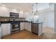 Well-lit kitchen featuring stainless steel appliances and white cabinets at 5795 Parkview Lake Dr, Orlando, FL 32821