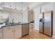 Well-lit kitchen with stainless steel appliances and adjoining breakfast nook at 5795 Parkview Lake Dr, Orlando, FL 32821