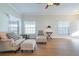 Bright living room featuring wood floors, neutral walls, and comfortable seating at 5795 Parkview Lake Dr, Orlando, FL 32821