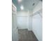 Spacious walk-in closet with carpet, wire shelving, and ample storage space at 5961 Vision Rd, St Cloud, FL 34771