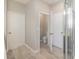 En-suite bathroom with a toilet and a glass-door shower at 6097 Monterey Cypress Trl, Sanford, FL 32773