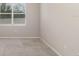 Cozy bedroom with neutral carpet, a window, and fresh paint at 6097 Monterey Cypress Trl, Sanford, FL 32773