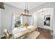 Bright dining room featuring a modern chandelier and a view of the outdoors at 636 Bainbridge Loop, Winter Garden, FL 34787