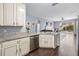 Open kitchen featuring granite countertops, stainless steel appliances, and seamless flow into the living area at 636 Bainbridge Loop, Winter Garden, FL 34787