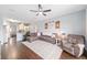 Spacious living room showcasing an open floor plan and seamless transition to the kitchen at 636 Bainbridge Loop, Winter Garden, FL 34787