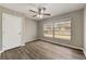 Bedroom featuring a ceiling fan, window, and neutral walls and flooring at 812 Oleander St, New Smyrna Beach, FL 32168