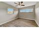 Bedroom featuring two windows and neutral walls and flooring at 812 Oleander St, New Smyrna Beach, FL 32168