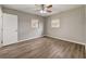 Bedroom featuring a ceiling fan, two windows, and neutral walls and flooring at 812 Oleander St, New Smyrna Beach, FL 32168