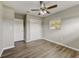 Bright bedroom with hardwood floors, ceiling fan and natural light at 812 Oleander St, New Smyrna Beach, FL 32168