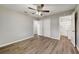 Bedroom featuring a closet, access to the bathroom, and neutral walls and flooring at 812 Oleander St, New Smyrna Beach, FL 32168