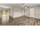 Bright living room with modern flooring, neutral walls, and sliding door access to the yard at 812 Oleander St, New Smyrna Beach, FL 32168