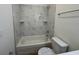 Bathroom featuring a shower and tub combination with stylish tile surround at 950 20Th St, Orlando, FL 32805