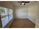 Bedroom featuring a ceiling fan, hardwood flooring, and natural light at 950 20Th St, Orlando, FL 32805