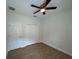 Bedroom featuring a ceiling fan, closet and flooring at 950 20Th St, Orlando, FL 32805