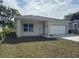 Exterior of a cozy, single-story home with a one car garage and freshly cut lawn at 950 20Th St, Orlando, FL 32805