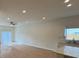 Bright living area with an open floor plan and a kitchen in the background at 950 20Th St, Orlando, FL 32805